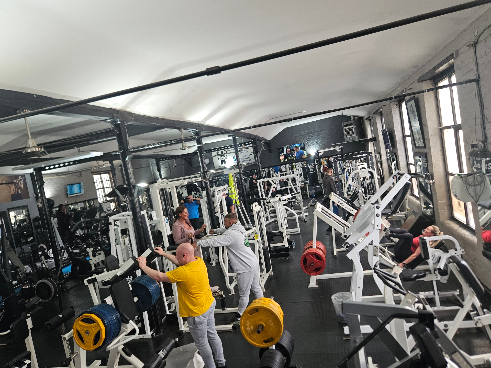 Members training across the main gym floor